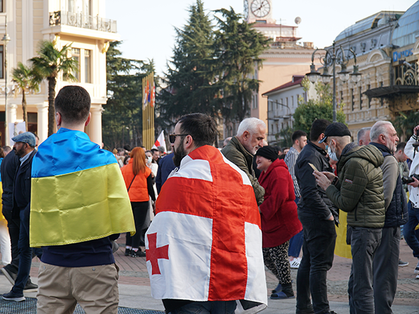 03-08-Japaridze blog post_shutterstock_2129421068_600x450 Two men with Georgian and Ukrainian flags in a demonstration for solidarity with Ukraine. Photo credit: Omer Karabacak on Shutterstock.