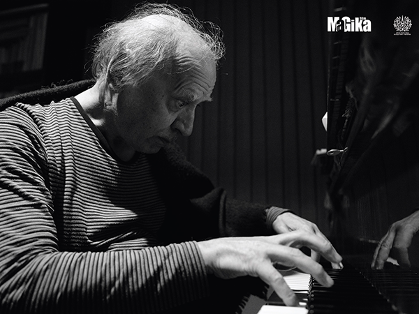 Image of Sylvestrov playing piano. Image links to event page.