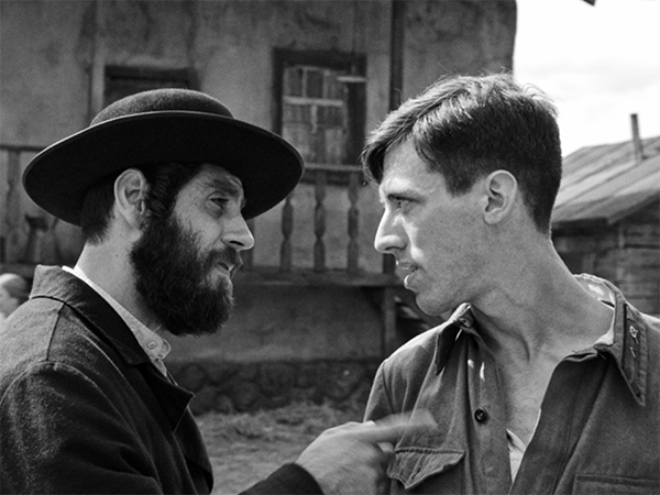 2023-11-29 SHTTL Image from the film of a man pointing at another man. Image links to event page.