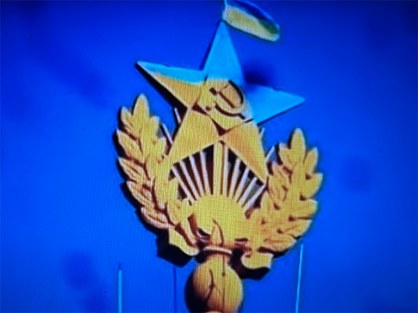 2023-11-29 Berezovenko Image of star with hammer and sickle in the color of the Ukrainian flag. Image links to event page.