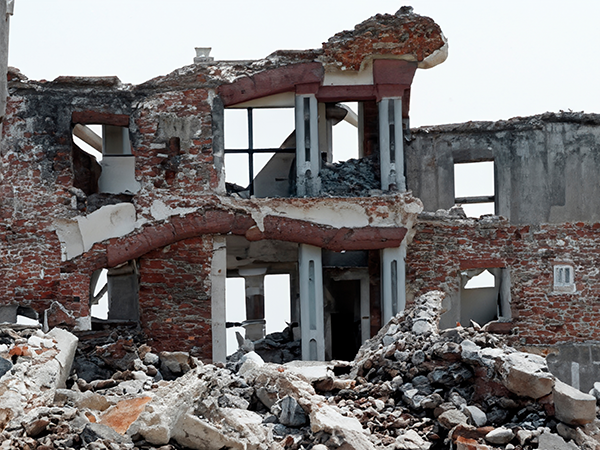 Destroyed building. Image links to event page.