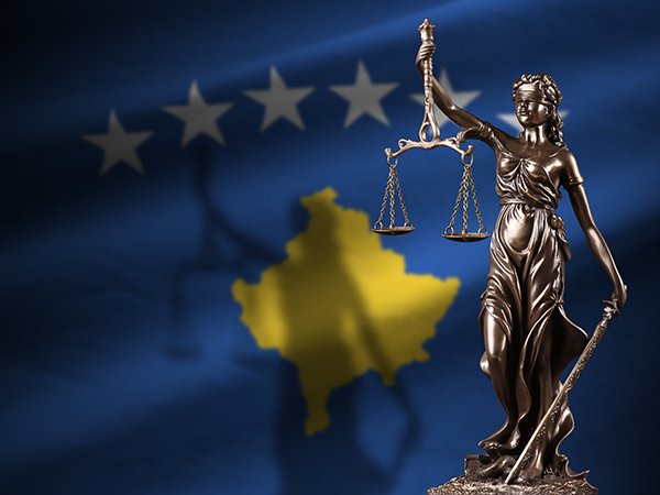 Lady of Justice in front of Kosovo flag. Image links to event page.