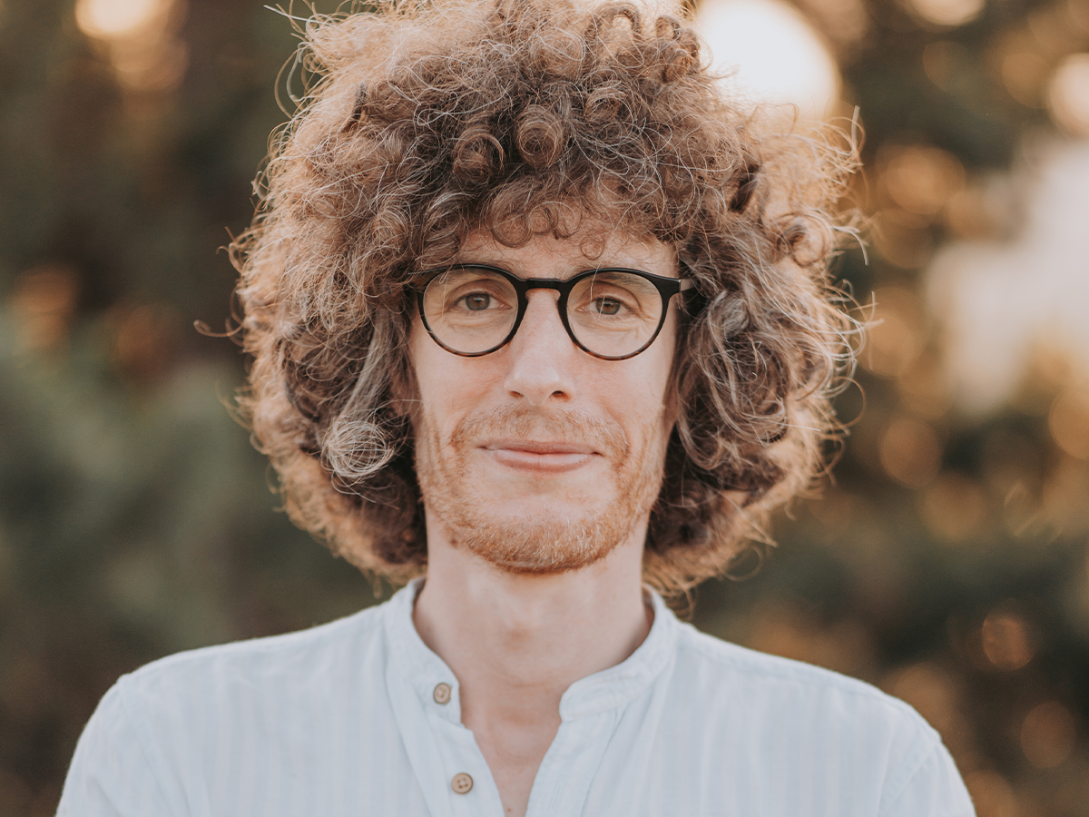 Headshot of András Vadas. Leads to a faculty spotlight interview.