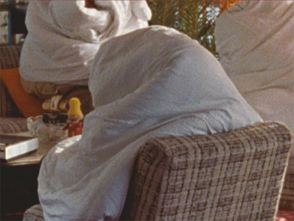 People on couches. Faces covered. Image links to event page.