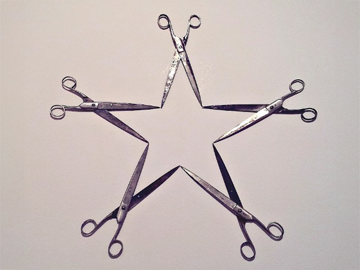 2025-10-10-11 Yugoslav Symposium Image of a 5 point star made of scissors. Image links to event page.