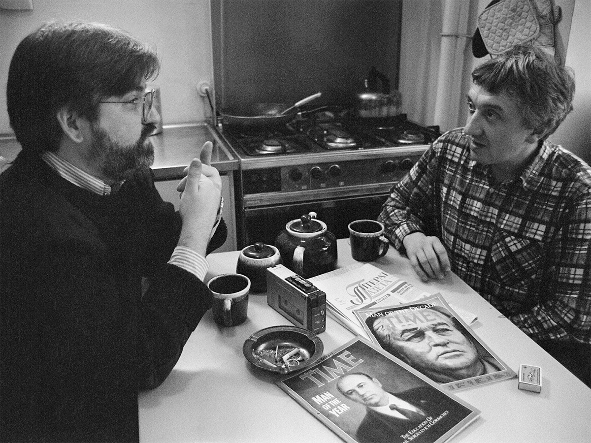 Image of John Kohan and Yury at a table. Image links to event page.