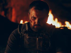 Soldier in front of a fire. Image links to event page.